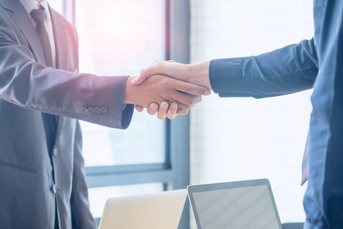 Two businessmen shaking hands