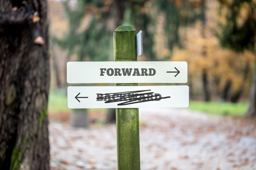 Street sign pointing forward.